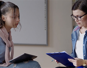 Students meeting with client in private office