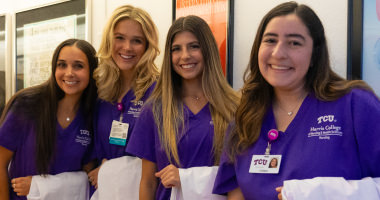 Students with their new white coats